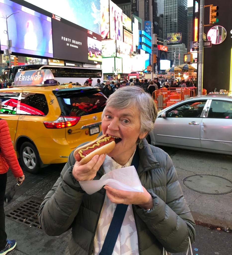 Woman eating hot dog in New York